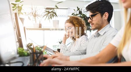 Creative team working on creative project in high tech office Stock Photo