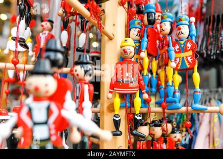 wooden dolls, toys and puppets for sale at souvenir market in Germany Stock Photo