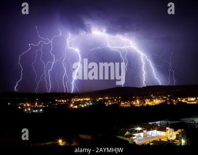 Multi lightening storm flash. Thunderstorm over city. Stock Photo