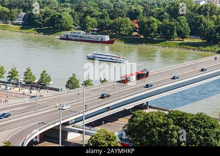 12 MAY 2018, SLOVAKIA, BRATISLAVA: SNP Bridge through Danude river with UFO Tower, aerial panoramic view in Bratislava Stock Photo