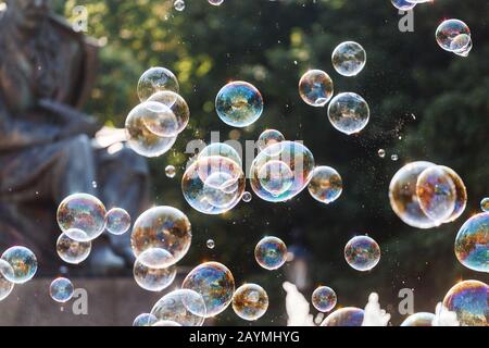 Many soap bubbles close-up in summer park Stock Photo
