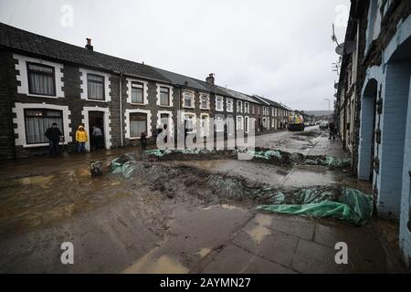 Trehorchy, Rhonnda Valley, UK 16th February 2020. UK Weather : Dumfries Street in Trehorchy, Rhondda Valley, where locals and residents made their own flood defenses after a culvert brought water cascading into the street from the hill above. Credit: Robert Melen/Alamy Live News. Stock Photo