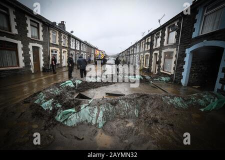 Trehorchy, Rhonnda Valley, UK 16th February 2020. UK Weather : Dumfries Street in Trehorchy, Rhondda Valley, where locals and residents made their own flood defenses after a culvert brought water cascading into the street from the hill above. Credit: Robert Melen/Alamy Live News. Stock Photo