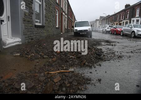 Trehorchy, Rhonnda Valley, UK 16th February 2020. UK Weather : Debris above Dumfries Street in Trehorchy, Rhondda Valley, where locals and residents made their own flood defenses after a culvert brought water cascading into the street from the hill above. Credit: Robert Melen/Alamy Live News. Stock Photo