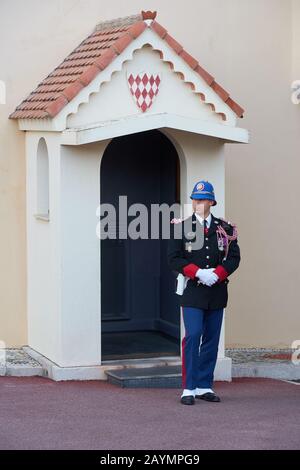 Monaco - April 05, 2019: Guard of Prince's Palace of Monaco near gatehouse in the evening Stock Photo