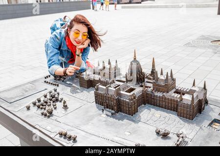 Traveler woman looking at Miniature model of Hungarian Parliament in mini park in Budapest Stock Photo