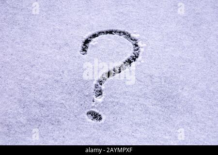 Question mark written with a finger on the snow on the windshield Stock Photo