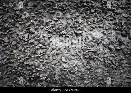 Rough dark gray stone wall texture Stock Photo