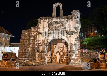 Night photo of Porta de Santiago, Gate of A Famosa Portuguese Fort, 16th Century, Melaka, Malaysia. Stock Photo