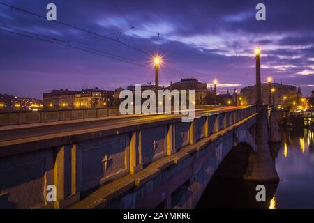 Manes Bridge is a road and tramway bridge over the Vltava river in Prague, Czech Republic. The bridge is named after the Czech painter Josef Manes. Stock Photo