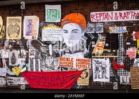 Posters and graffiti from the political unrest and protests in Lastarria, Central Santiago, Metropolitan Region, capital city of Chile, South America Stock Photo