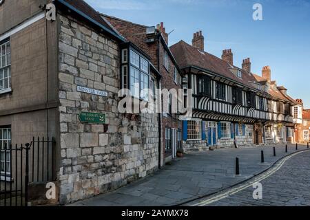 Corner of Minster Yard and College Street with timber framed building of  St William's College,York, England, Uk Stock Photo