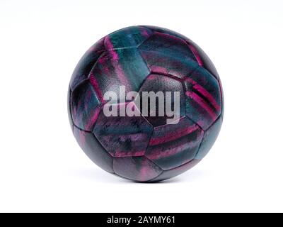 Black football or soccer ball with abstract purple and blue design and textured surface isolated on white with small drop shadow and copy space Stock Photo