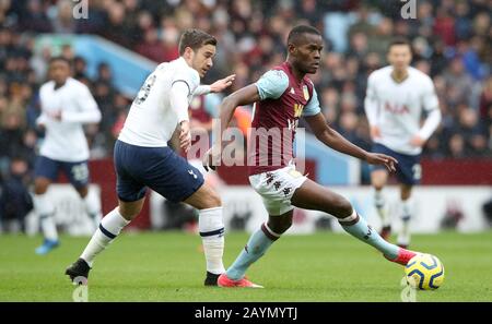 Tottenham Hotspur's Harry Winks (left) and Aston Villa's Kortney Hause battle for the ball during the Premier League match at Villa Park, Birmingham. Stock Photo