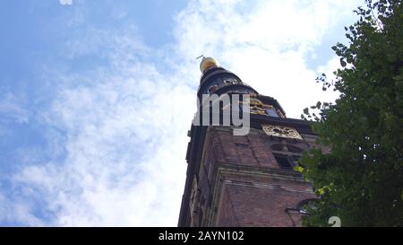 COPENHAGEN, DENMARK - JUL 06th, 2015: Our Saviour's Vor Frelsers Kirke - one of Denmark's most famous churches. Serpentine spire was inaugurated in Stock Photo