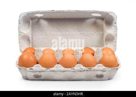 Brown eggs in the cardboard package box front view. Clipping path for easy cut out Stock Photo