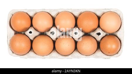 Ten Brown eggs in the cardboard package box top view isolated on white. Clipping path for easy cut out Stock Photo