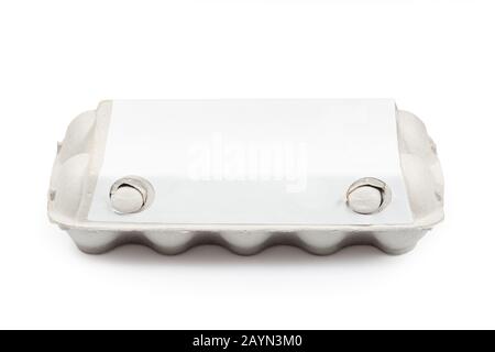 Blank egg cardboard box package box high angle view isolated on white. Clipping path for easy cut out. Eggs pack mockup. Stock Photo