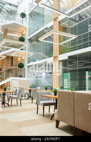 open office design. charming office room with moder desks and chairs, vertical shot. creating unique working environment Stock Photo