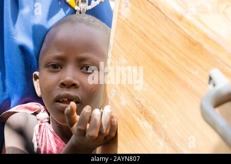 NGARE SERO. TANZANIA - AUGUST 20, 2019: child asks for something to eat at Ngare Sero area near Lake Natron and Ol Doinyo Lengai volcano in Tanzania Stock Photo