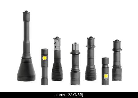 Many camping or tactical handheld pocket black flashlights isolated studio shot Stock Photo