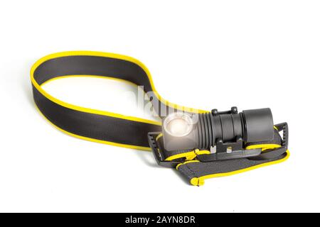 Head lamp flashlight with light beam studio shot Stock Photo