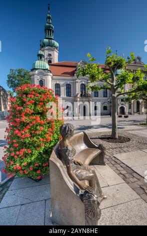 Memorial to Daisy, Princess of Pless, created by Joachim Krakowczyk in 2009, Evangelical Church behind, at Rynek in Pszczyna, Silesia, Poland Stock Photo