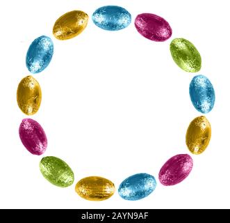 Easter egg circle, frame, isolated on white. Bright colourful chocolate, foil wrapped. Stock Photo