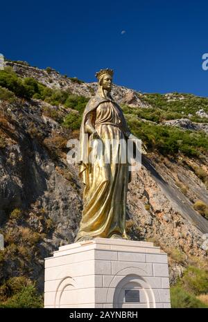 Gold statue of the Virgin Mary outside of the House of the Virgin Mary, near Ephesus, Turkey Stock Photo
