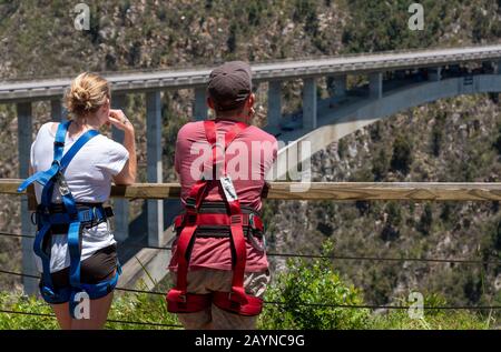 Bloukrans Bridge, Eastern Cape, South Africa. Dec 2019. Young couple wearing harnesses for a bungee jump from Bloukrans Bridge Stock Photo