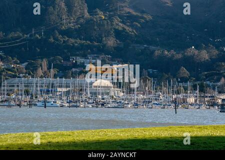 A seaplane descends for a landing in Sausalito, CA. Stock Photo