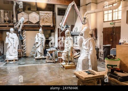 19 OCTOBER 2018, FLORENCE, ITALY: restoration of ancient medieval religious statues in the workshop Stock Photo