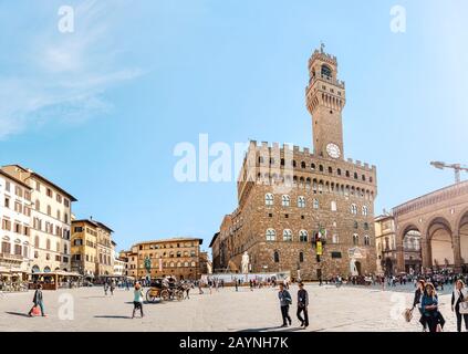 19 OCTOBER 2018, FLORENCE, ITALY: Panoramic view of the palazzo Vecchio and Clock tower building from Signoria square Stock Photo