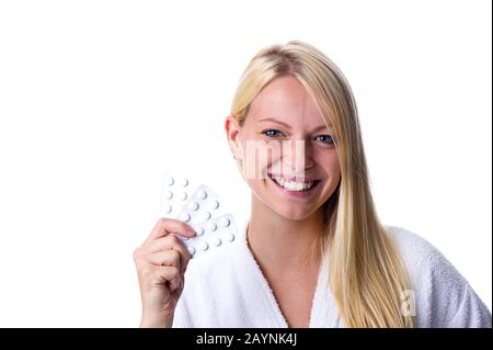 Frau mit Pillenpackung im Mund Stock Photo