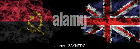 Flags of Angola and United Kingdom on Black background, Angola vs United Kingdom Smoke Flags Stock Photo