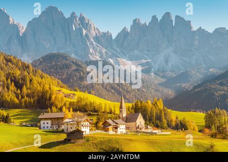 Santa Maddalena village in front of the Geisler or Odle Dolomites Group, Val di Funes, Val di Funes, Trentino Alto Adige, Italy, Europe. Stock Photo