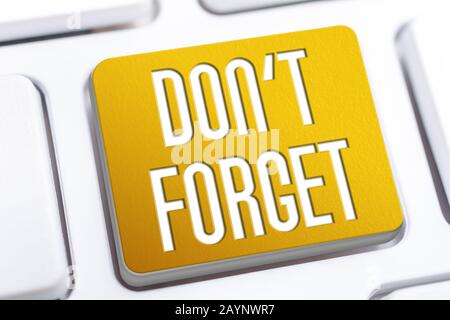 The Words Don't Forget On A Yellow Button On A White Keyboard, Remind Yourself Concept Stock Photo