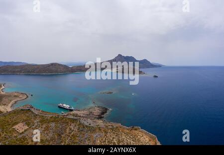 Panoramic aerial drone view of Gramvousa island near Crete, Greece. Balos beach. Magical turquoise waters, lagoons, beaches of pure white sand in summ Stock Photo