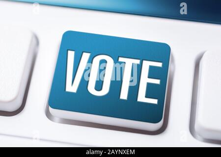 Blue Vote Button On A White Keyboard, Time For A Change Concept Stock Photo