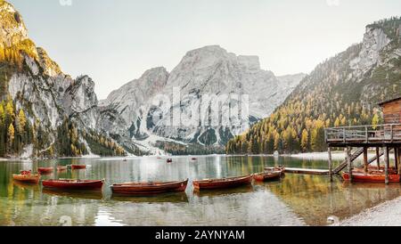 A magical panoramic landscape with calm colors of the famous lake Braies in the Dolomites Alps during autumn season. A popular tourist attraction Stock Photo