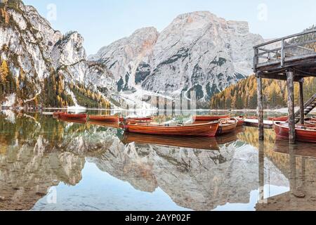 A magical panoramic landscape with calm colors of the famous lake Braies in the Dolomites Alps during autumn season. A popular tourist attraction Stock Photo