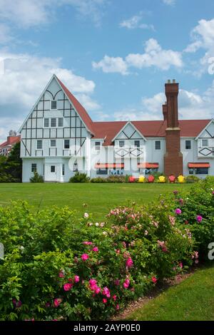 Colorful Adirondack Chairs in front of the Keltic Lodge Resort and Spa, which is located along the Cabot Trail on Cape Breton Island, Nova Scotia, Can Stock Photo