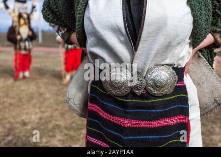 Traditional Bulgarian silver belt buckle on ladies costume. Antique belt buckles ottoman empire period. Stock Photo