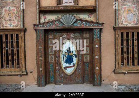 The front door of the chapel of Santo Nino de Atocha at El Santuario de Chimayo in the small community of El Potrero just outside of Chimayo, New Mexi Stock Photo