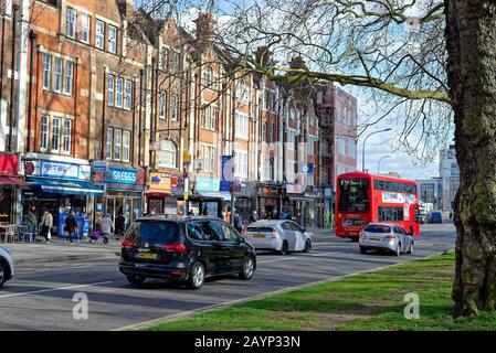 A busy Uxbridge Road on Shepherds Bush Green West London England UK Stock Photo