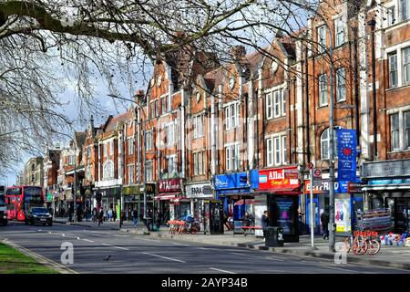 A busy Uxbridge Road on Shepherds Bush Green West London England UK Stock Photo