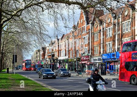 A busy Uxbridge Road on Shepherds Bush Green West London England UK Stock Photo