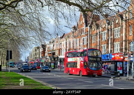 A busy Uxbridge Road on Shepherds Bush Green West London England UK Stock Photo