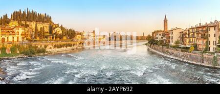 Panoramic cityscape view of Verona old town and bridge over Adige river. Travel destination in Italy concept