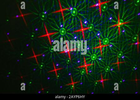 Abstract background, dot star circle round glitter defocus backdrop pattern. Illumination of luminosity blurred light on a dark, abstract multicolored Stock Photo